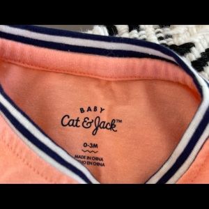 NWT Cat & Jack infant one piece. Peach/coral color with navy strips on cuffs.